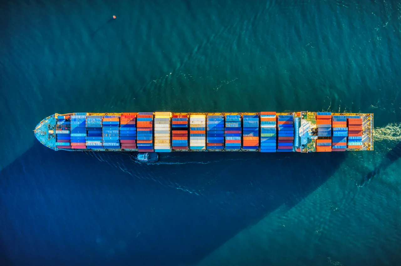 Aerial view of a container ship carrying compliance-critical cargo